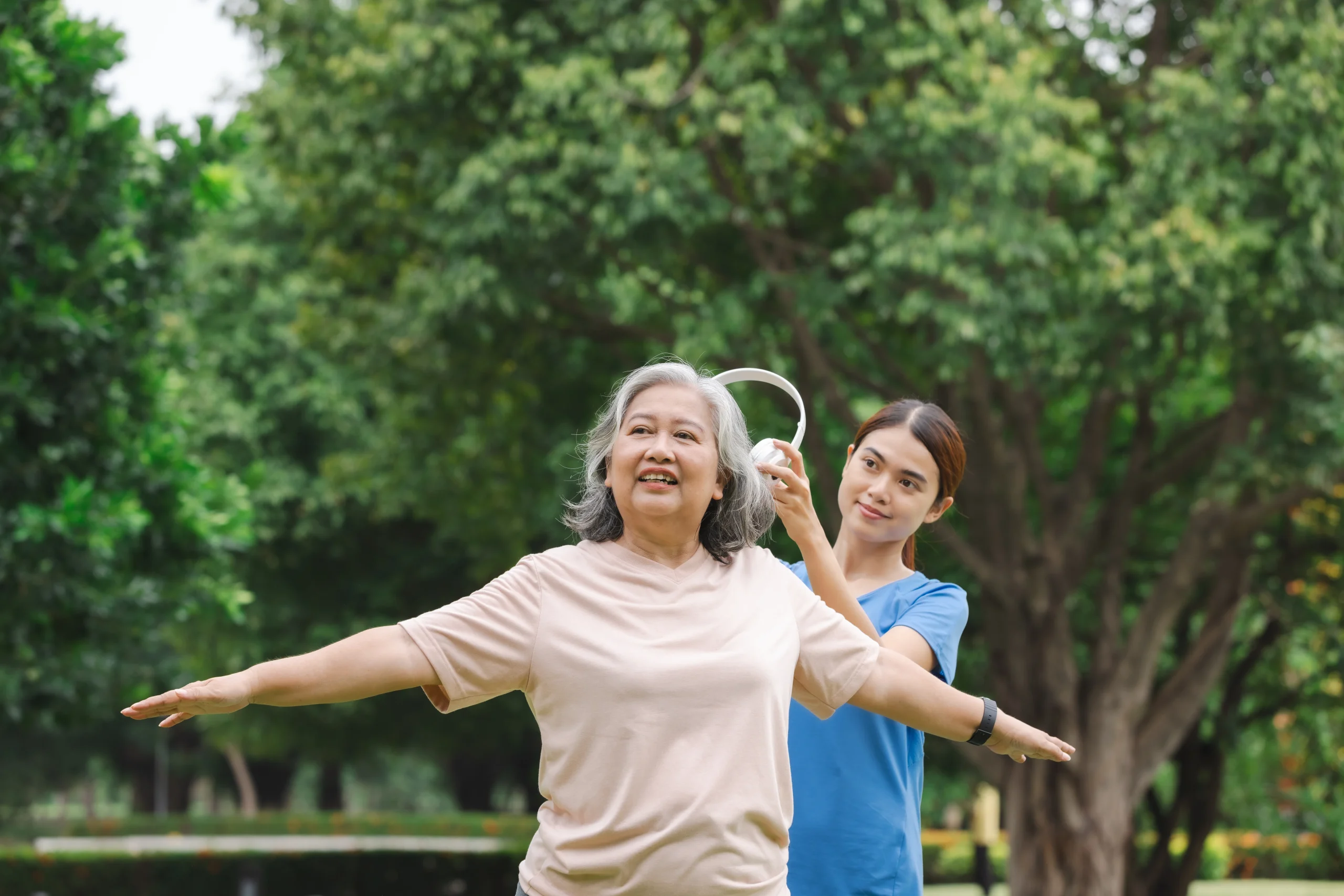 Vestibular Rehabilitation Calgary physiotherapist assisting a senior with balance training and stability exercises outdoors