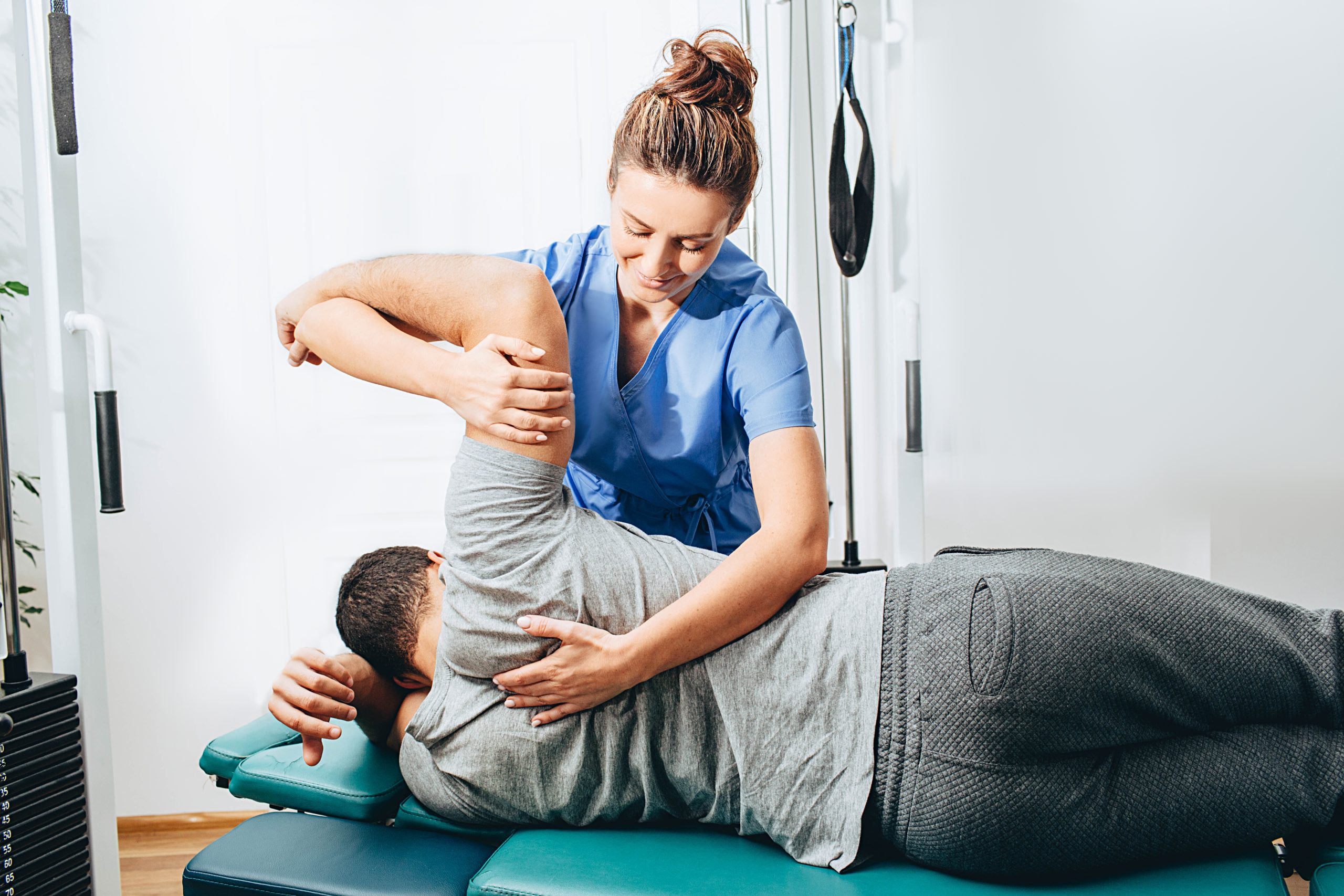 Knee Replacement Rehab Calgary — clinician discussing assessment with a patient