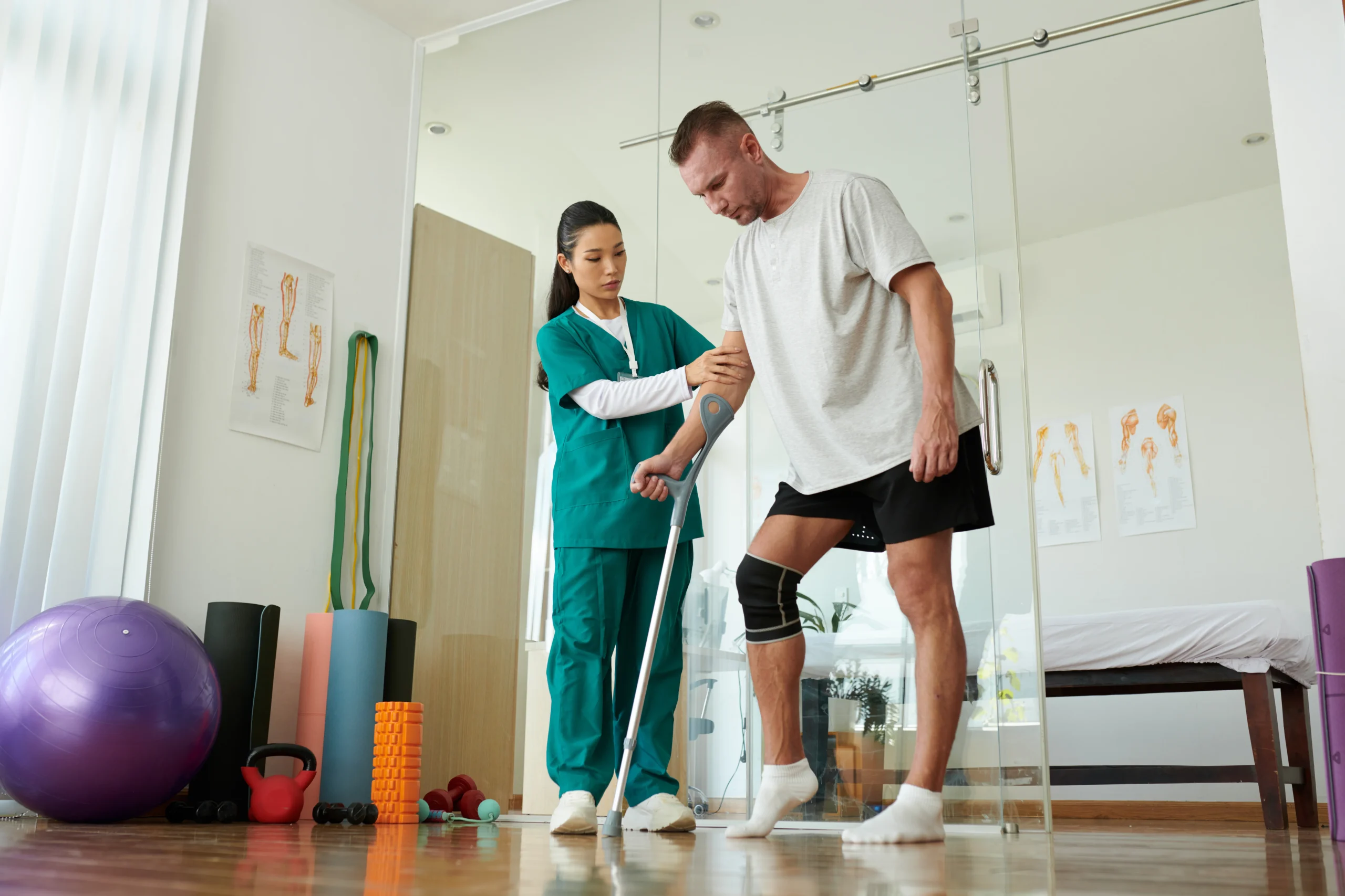 Hip Replacement Rehab Calgary — clinician discussing assessment with a patient