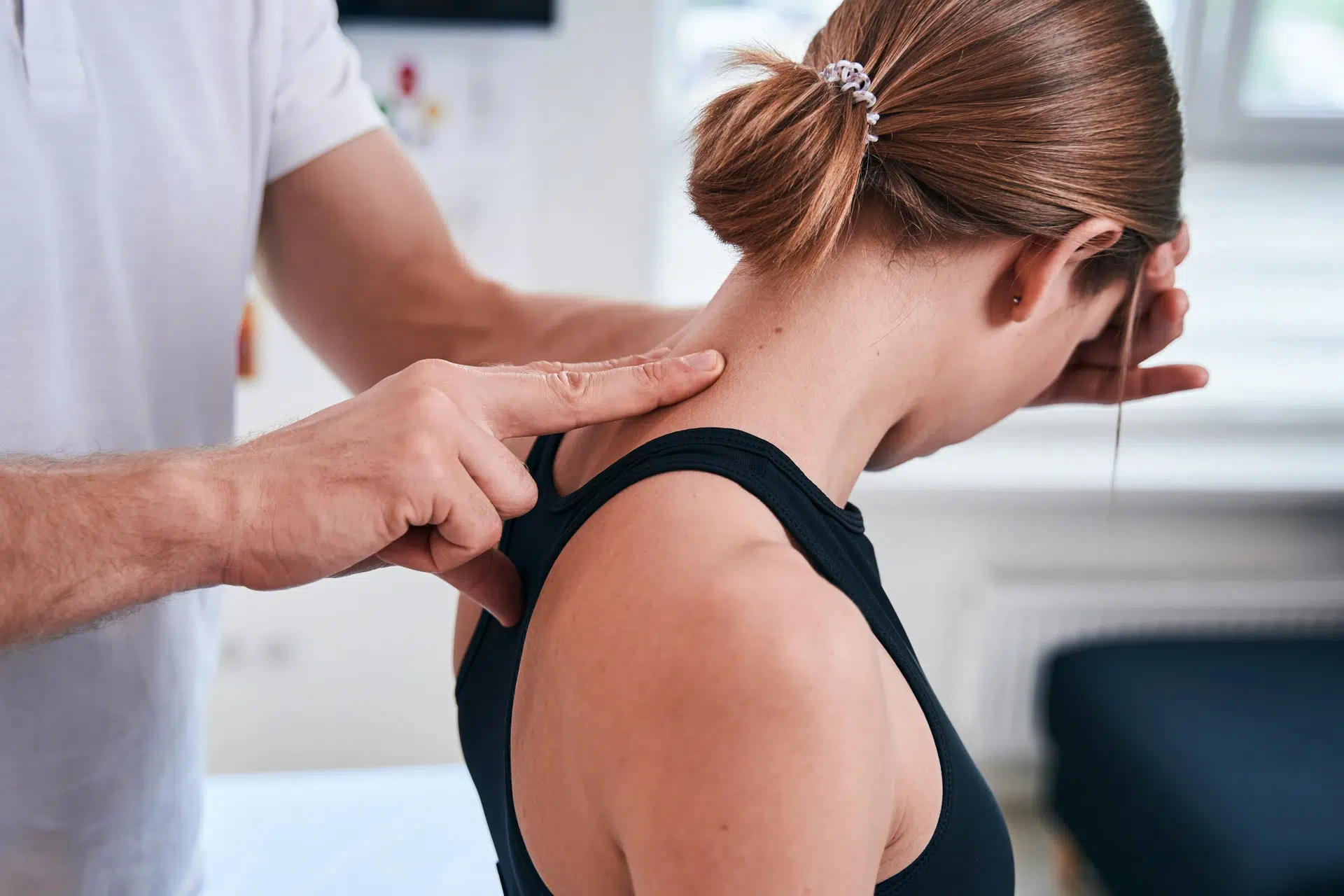 Neck Pain Physiotherapy Calgary helping a patient manage neck stiffness and pain at Apollo Physiotherapy